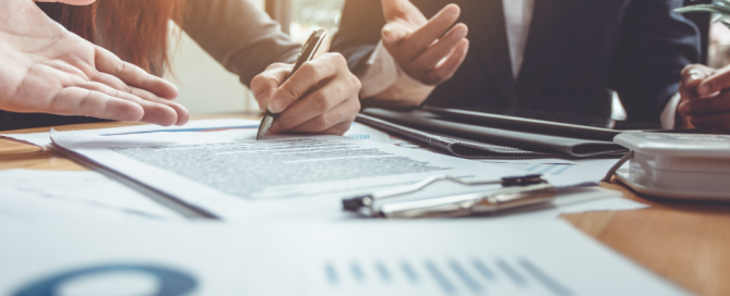 people meeting and discussing data