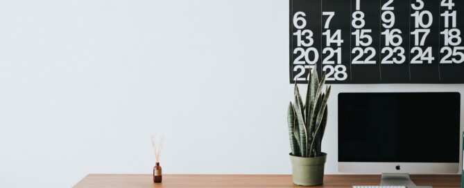 desk setting with calendar on wall